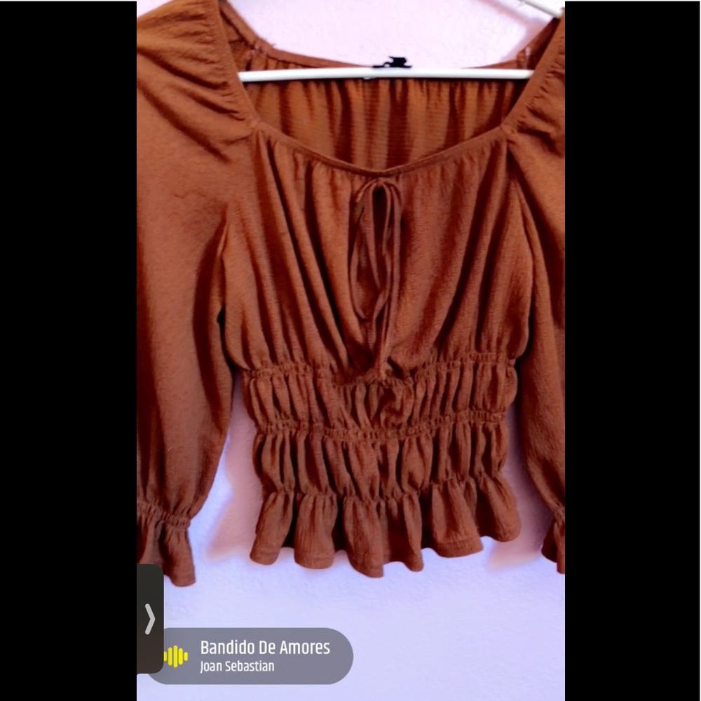 cute brown orange shirt wit ruffles !